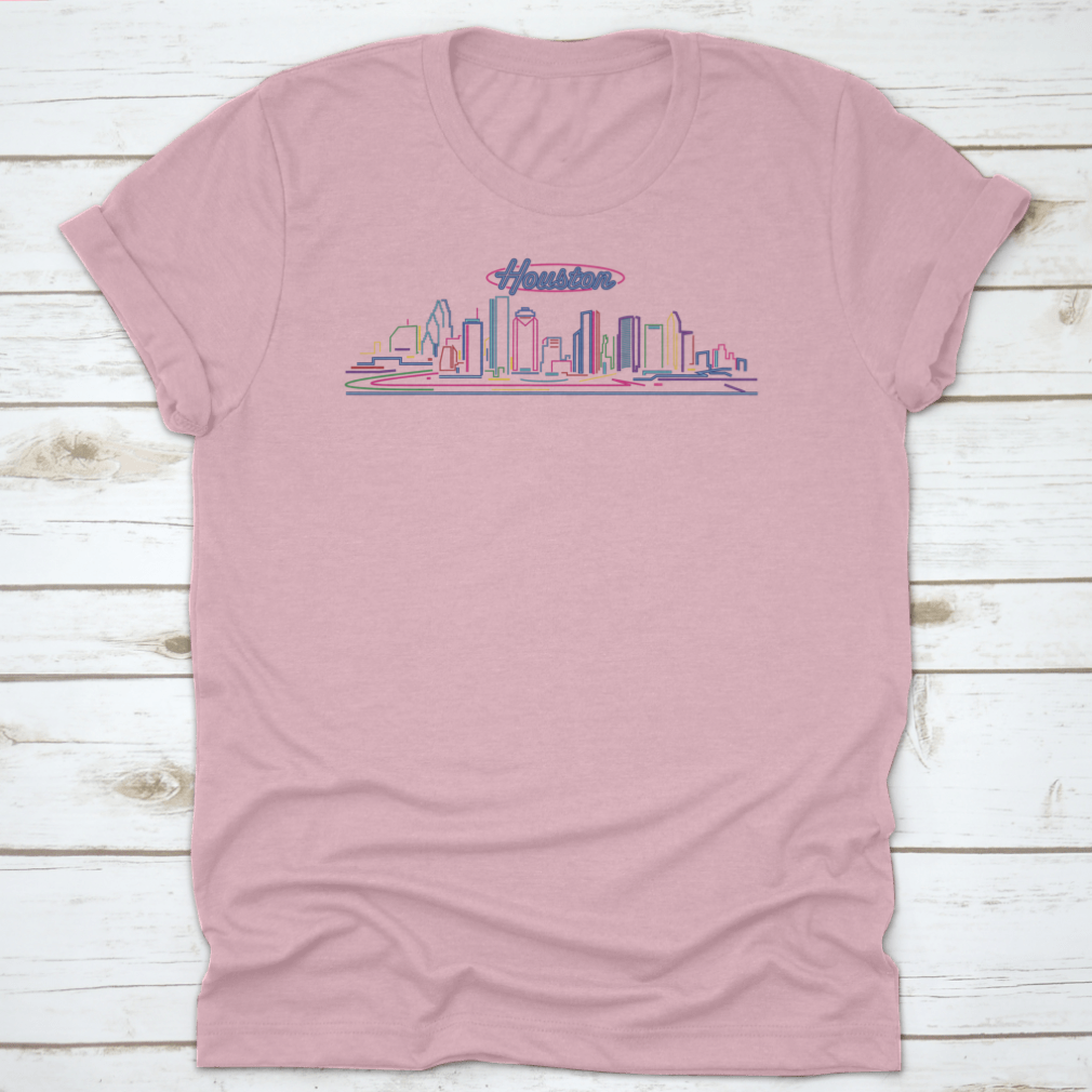 A vibrant t-shirt featuring the illuminated Houston skyline at night, showcasing the cityscape against a blue hour backdrop.