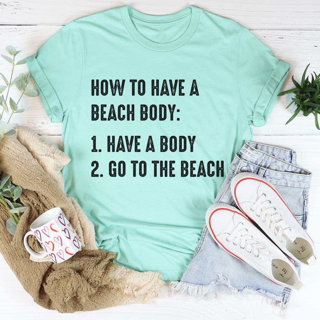 A stylish How to Have A Beach Body T-Shirt made from soft cotton, featuring double stitching for durability, perfect for beach outings.