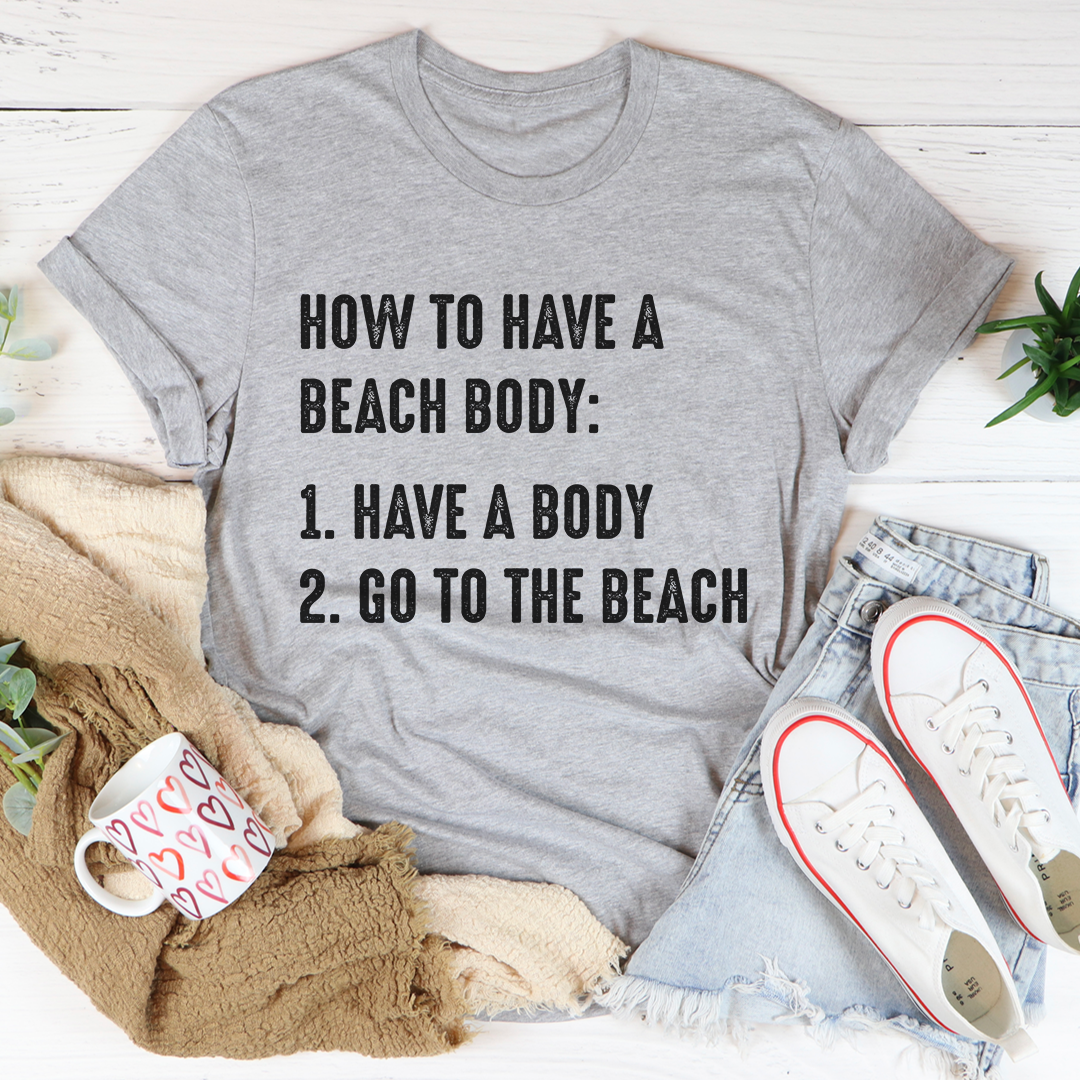 A stylish How to Have A Beach Body T-Shirt made from soft cotton, featuring double stitching for durability, perfect for beach outings.