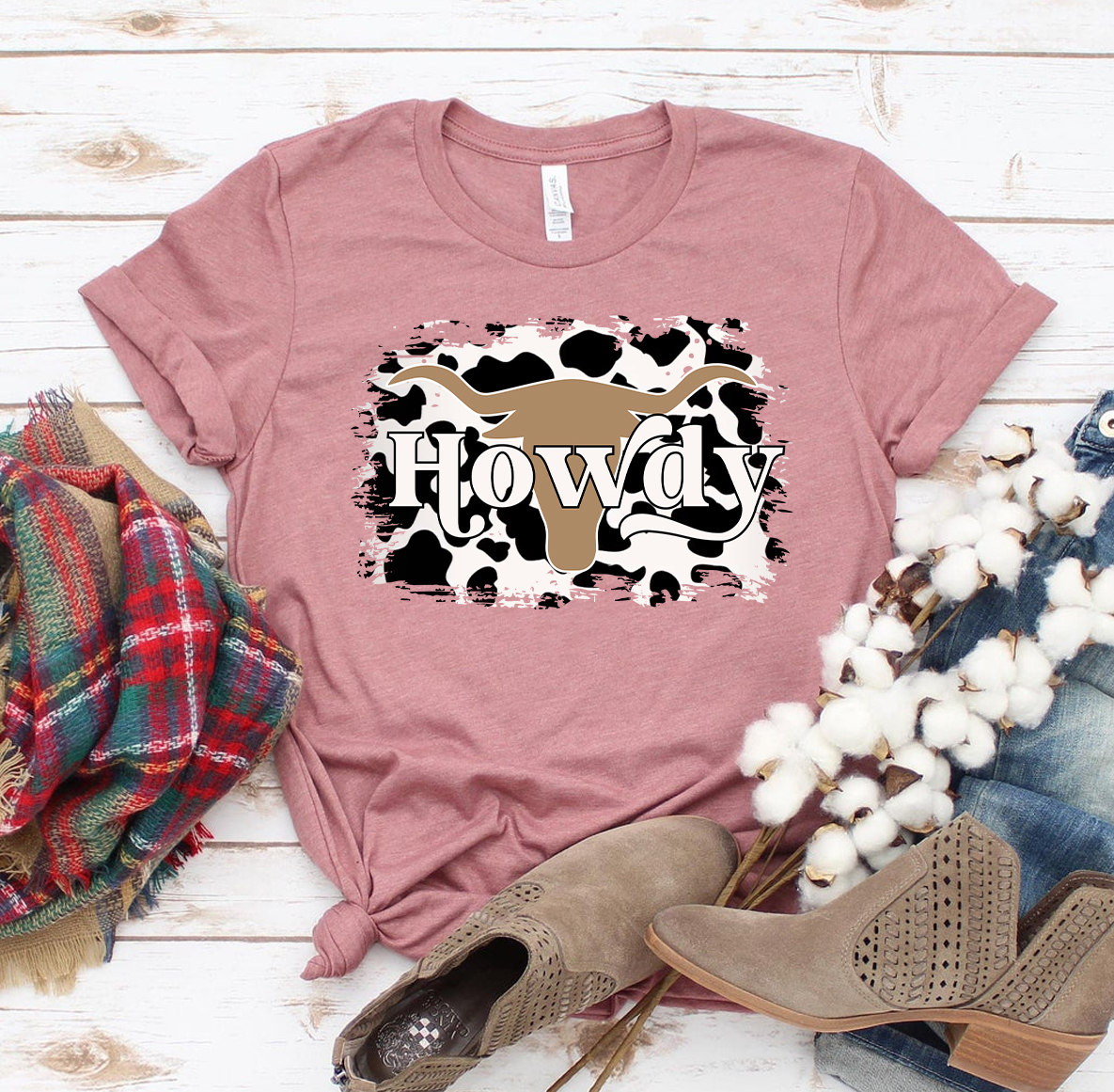 A stylish Howdy Cow T-shirt made from premium ring spun cotton, featuring a vibrant flex print design.