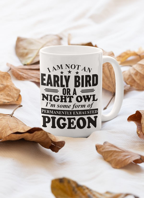 A stylish ceramic mug with the phrase 'I Am Not An Early Bird Or A Night Owl' printed on it, featuring a glossy finish and sturdy handle.