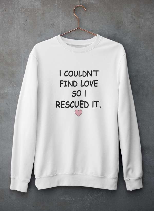 Cozy sweatshirt featuring the phrase 'I Couldn't Find Love So I Rescued It', made from a soft cotton/poly fleece blend.