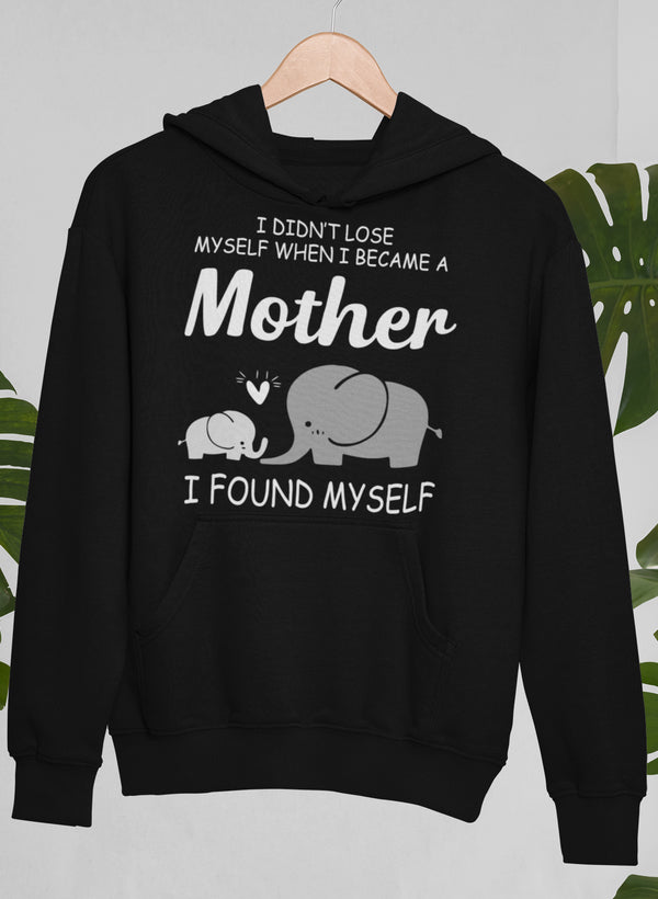 A cozy hoodie featuring the phrase 'I Didn't Lose Myself When I Became A Mother I Found Myself', showcasing a stylish design perfect for mothers.