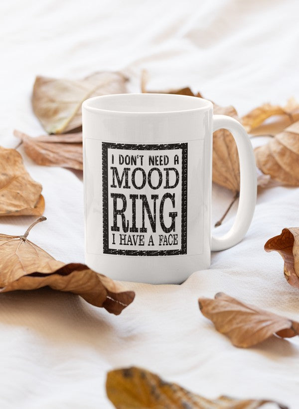 A glossy 11oz ceramic mug with the phrase 'I Don't Need A Mood Ring' printed on it, featuring a sturdy handle and vibrant design.