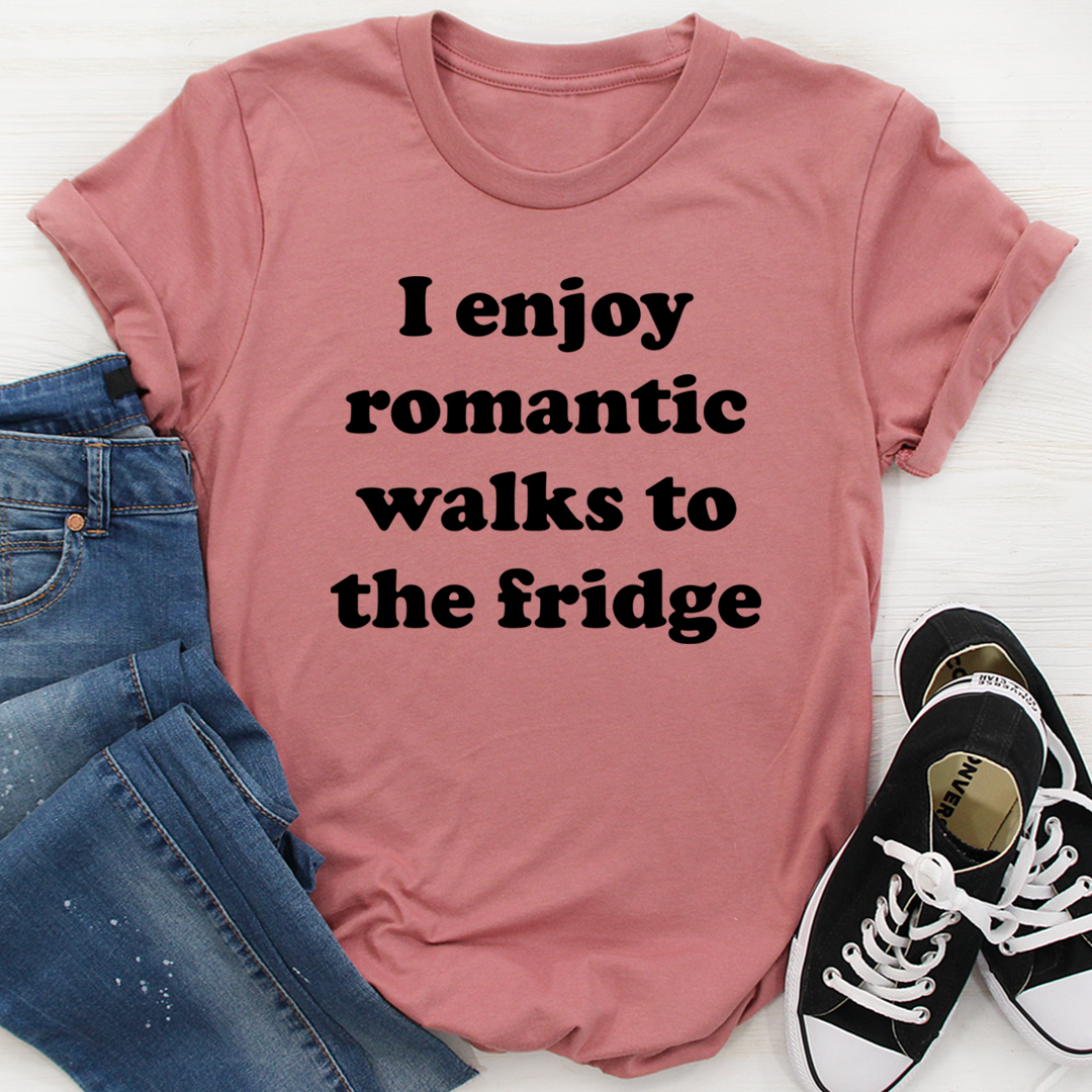 A humorous t-shirt with the phrase 'I Enjoy Romantic Walks To The Fridge' printed on it, showcasing its soft cotton fabric and durable stitching.