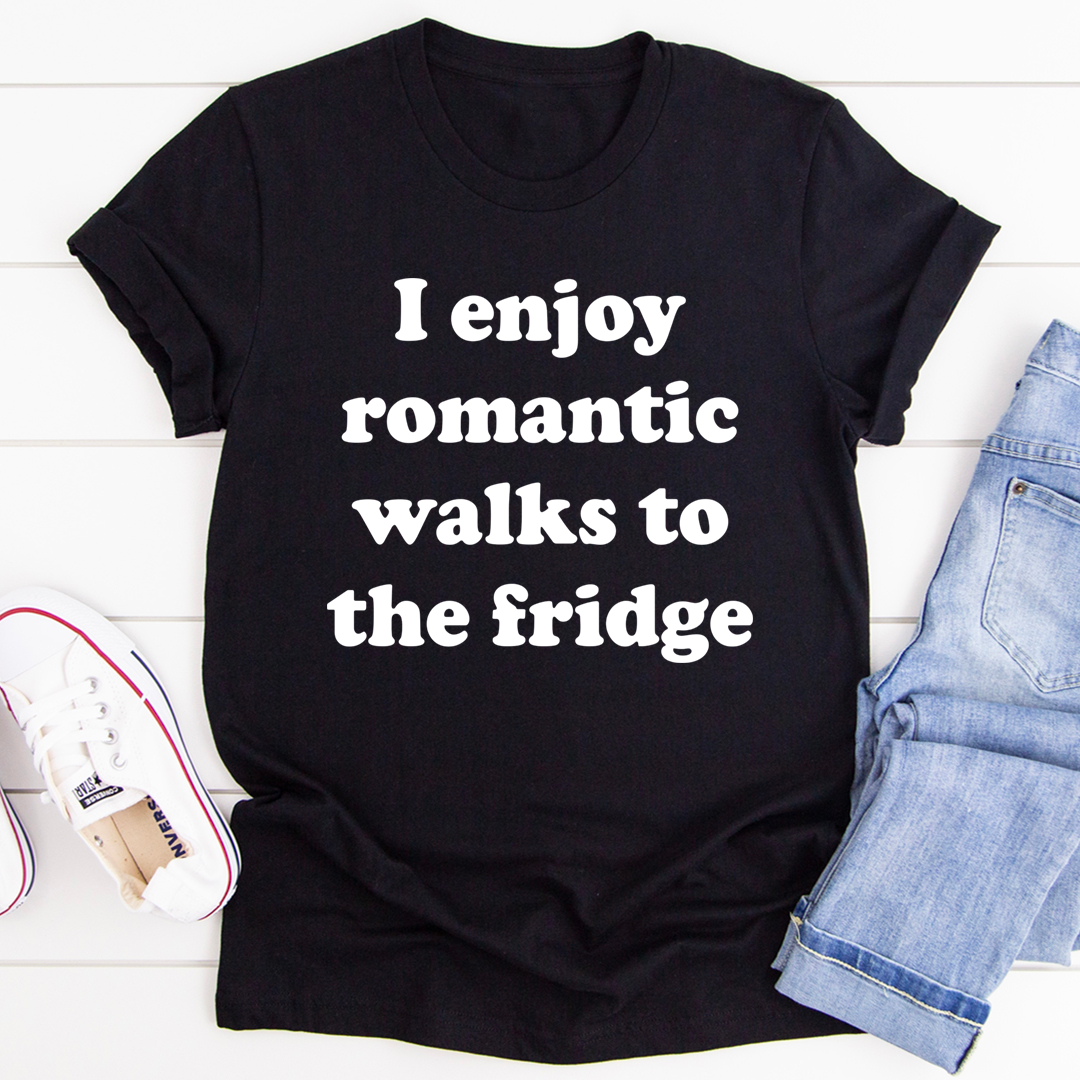 A humorous t-shirt with the phrase 'I Enjoy Romantic Walks To The Fridge' printed on it, showcasing its soft cotton fabric and durable stitching.