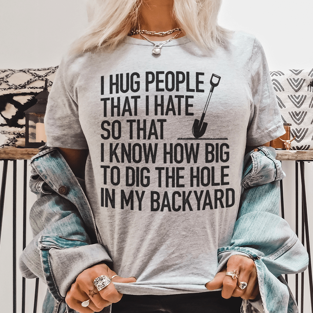 I Hug People That I Hate T-Shirt displayed on a mannequin, showcasing its soft cotton fabric and humorous design.