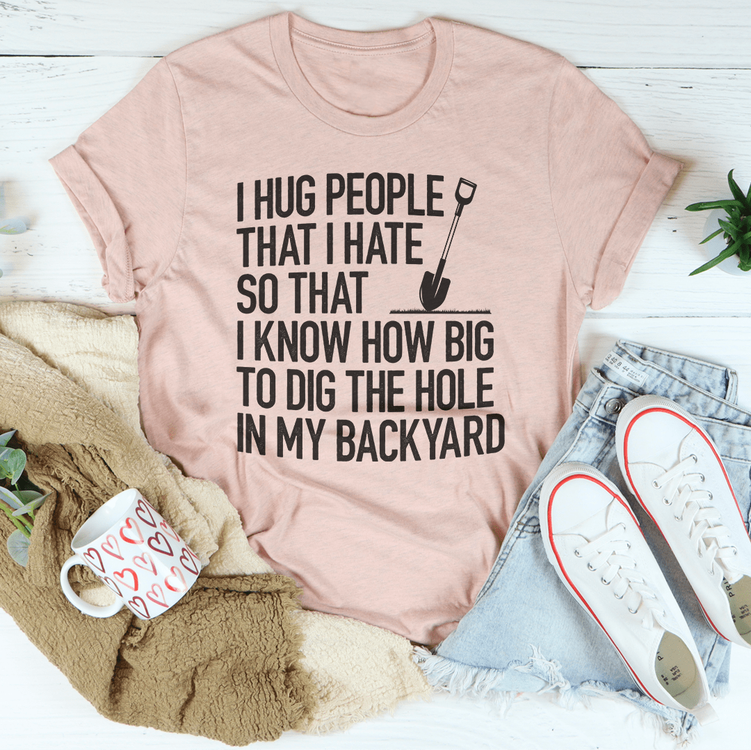 I Hug People That I Hate T-Shirt displayed on a mannequin, showcasing its soft cotton fabric and humorous design.