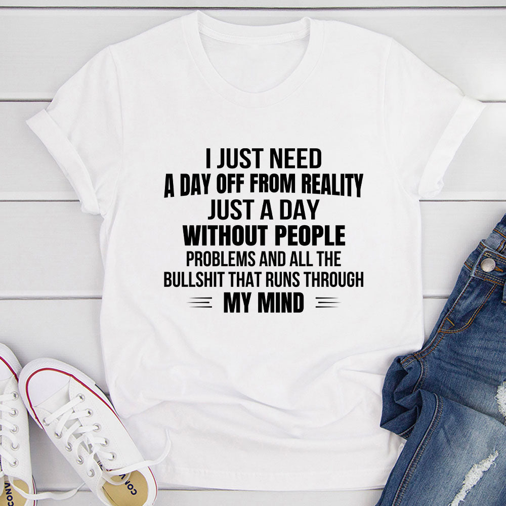 A comfortable and stylish t-shirt featuring the phrase 'I Just Need A Day Off From Reality', made from soft ring-spun cotton.