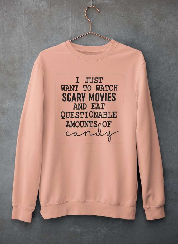 Cozy sweatshirt featuring the phrase 'I Just Want To Watch Scary Movies And Eat Candy', perfect for movie nights.