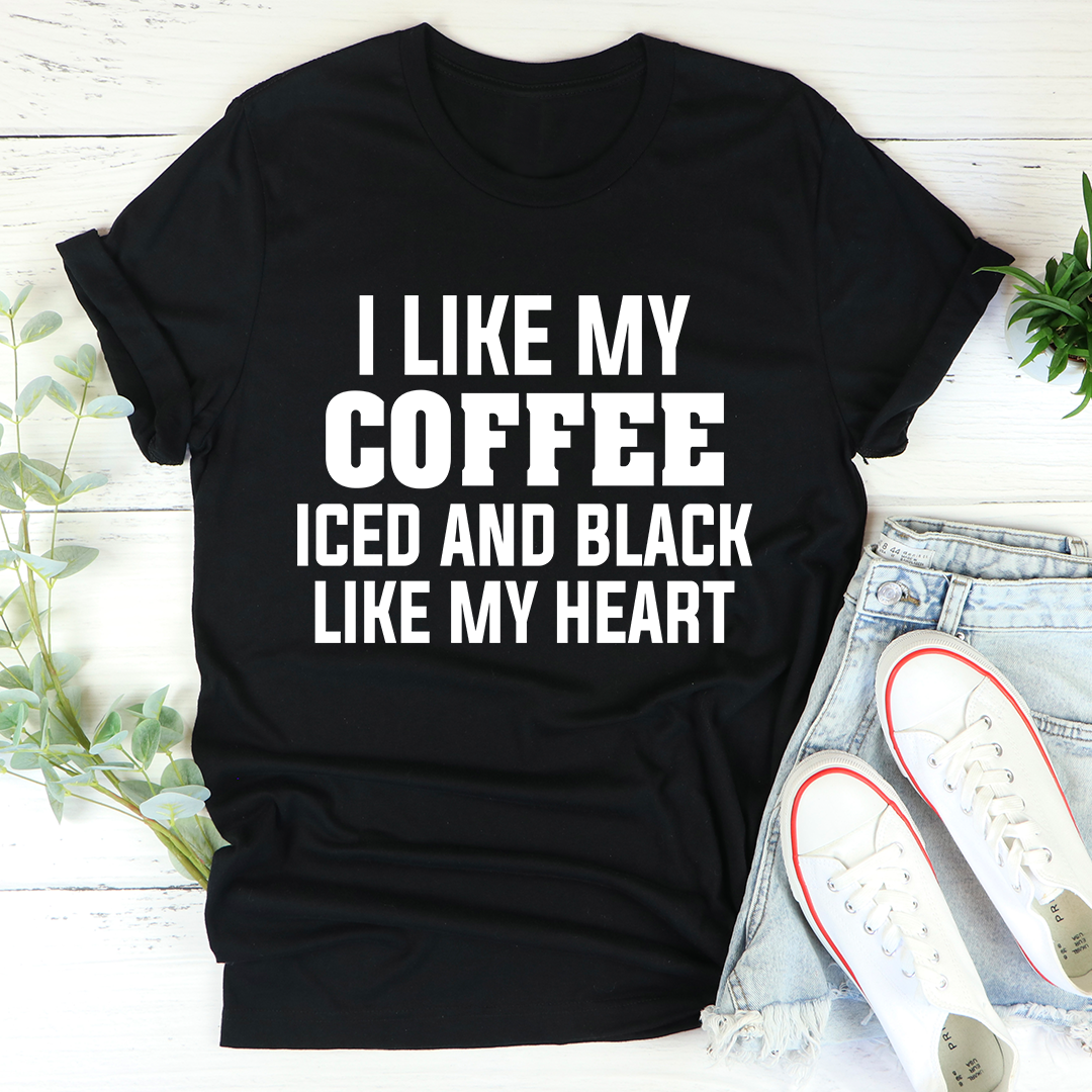 Black t-shirt with the phrase 'I Like My Coffee Iced And Black Like My Heart' printed in white, showcasing a stylish design for coffee lovers.