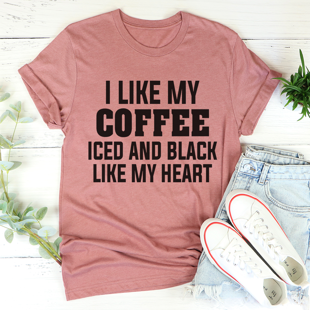 Black t-shirt with the phrase 'I Like My Coffee Iced And Black Like My Heart' printed in white, showcasing a stylish design for coffee lovers.