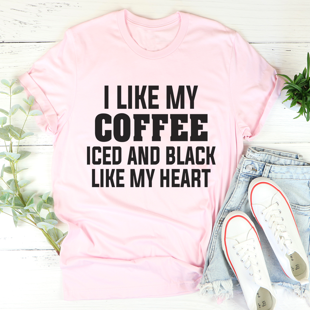 Black t-shirt with the phrase 'I Like My Coffee Iced And Black Like My Heart' printed in white, showcasing a stylish design for coffee lovers.