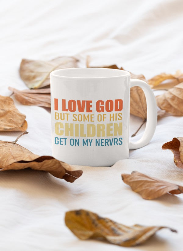 A stylish 11oz ceramic mug with the phrase 'I Love God But Some Of His Children' printed in a modern font, featuring a glossy finish and sturdy handle.