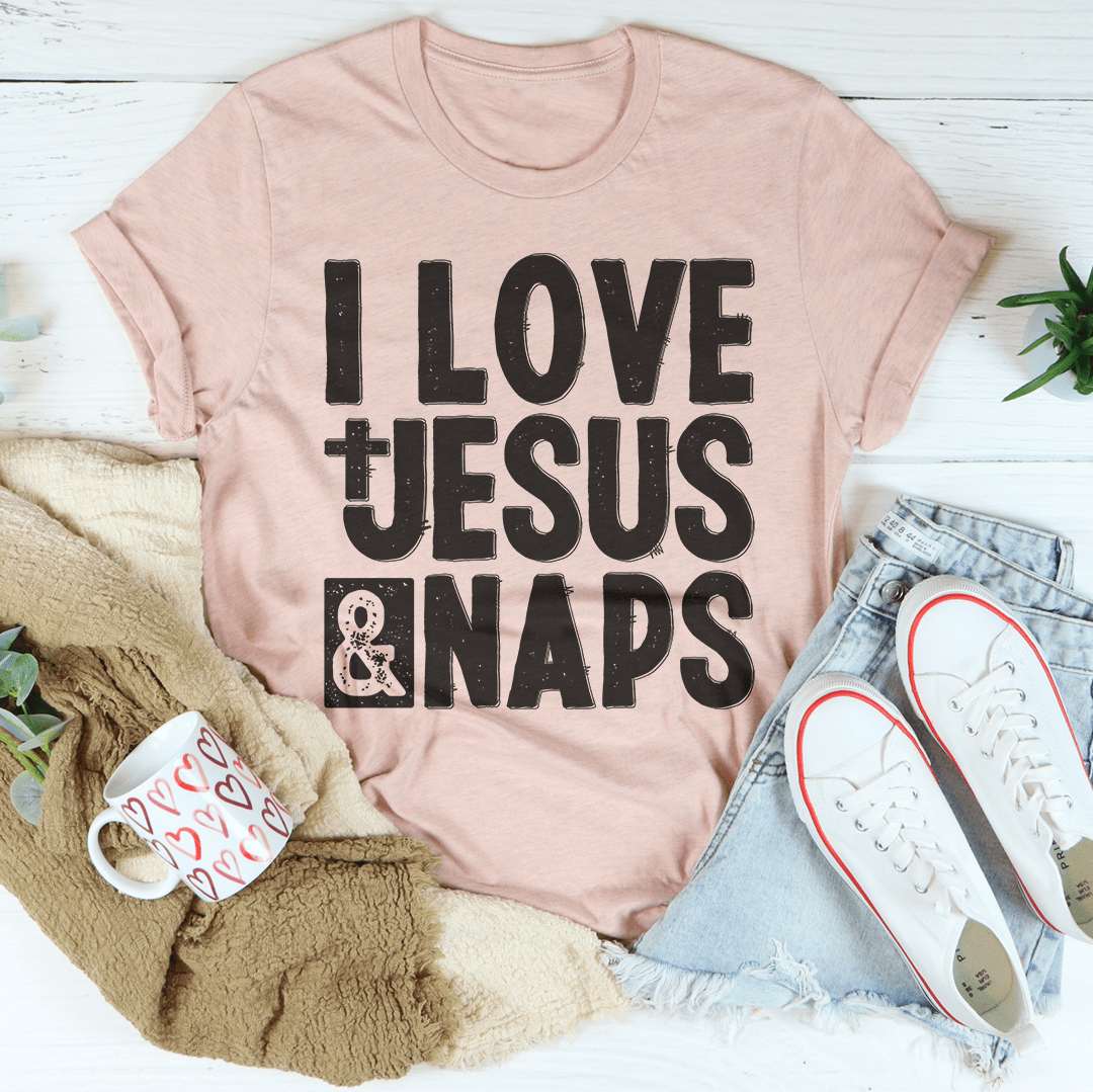 I Love Jesus & Naps T-Shirt displayed on a hanger, showcasing its soft fabric and vibrant print.