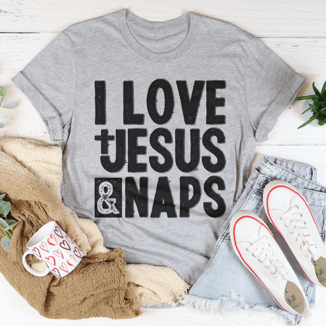 I Love Jesus & Naps T-Shirt displayed on a hanger, showcasing its soft fabric and vibrant print.