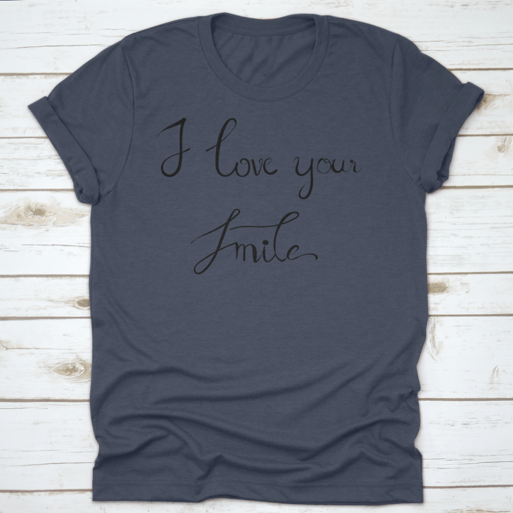 A stylish t-shirt featuring the handwritten calligraphy 'I Love Your Smile' on a white background, showcasing its unique design.