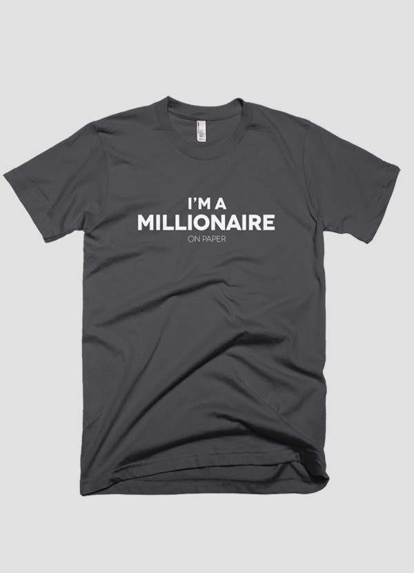 A humorous T-shirt featuring the phrase 'I'm a Millionaire on Paper', showcasing a casual and stylish design.