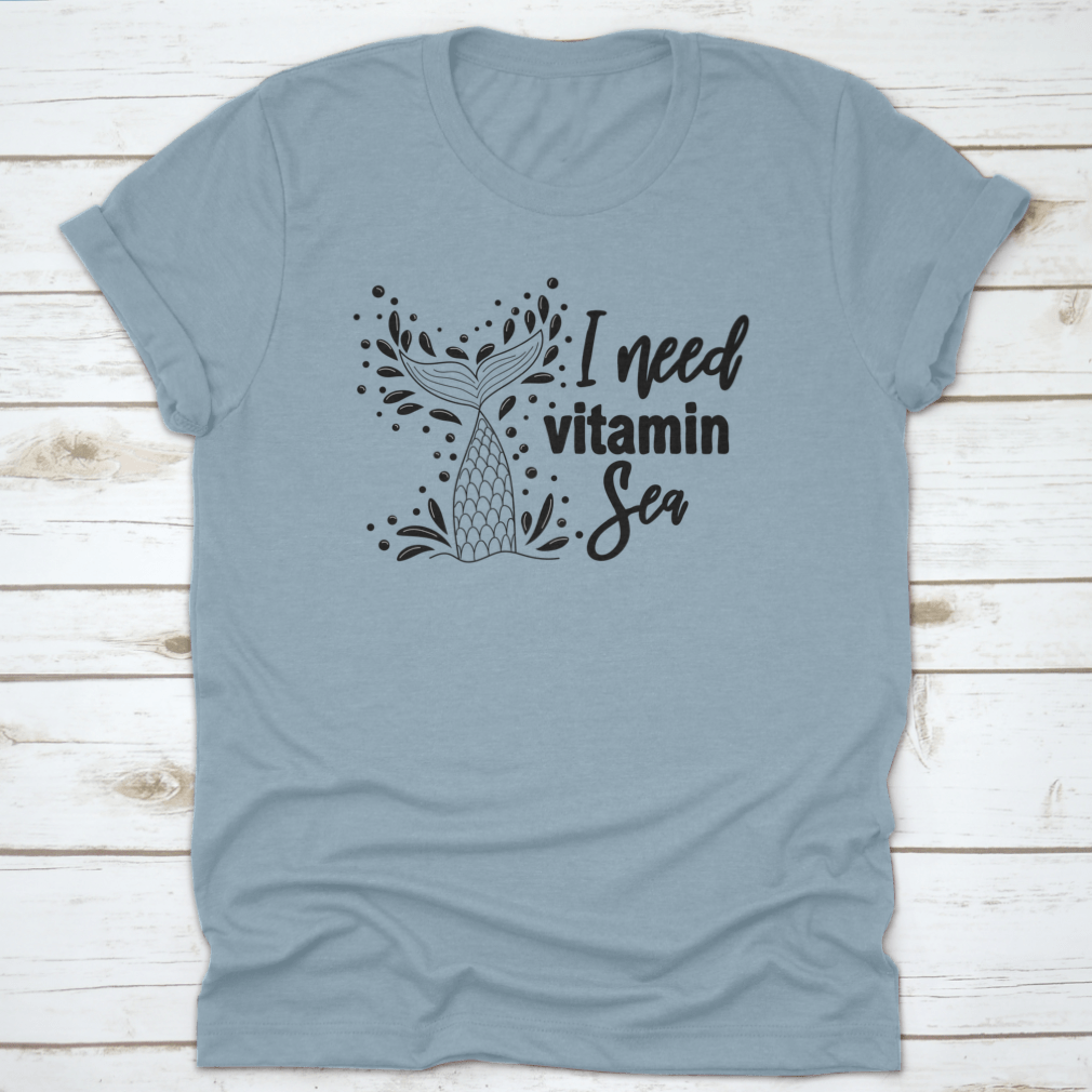 A stylish 'I Need Vitamin Sea' T-Shirt featuring artistic design, made from 100% cotton, perfect for beach lovers.