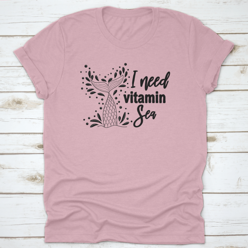 A stylish 'I Need Vitamin Sea' T-Shirt featuring artistic design, made from 100% cotton, perfect for beach lovers.