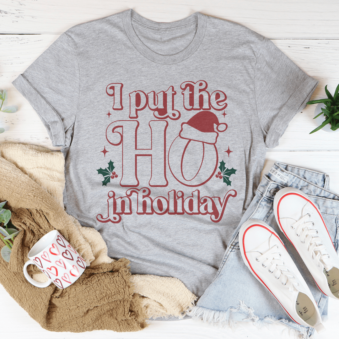 I Put The HO In Holiday T-Shirt featuring festive design and soft cotton fabric, perfect for holiday celebrations.