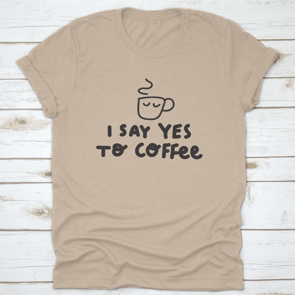 A humorous t-shirt featuring the phrase 'I Say Yes To Coffee' with a vector illustration, made from soft cotton fabric.