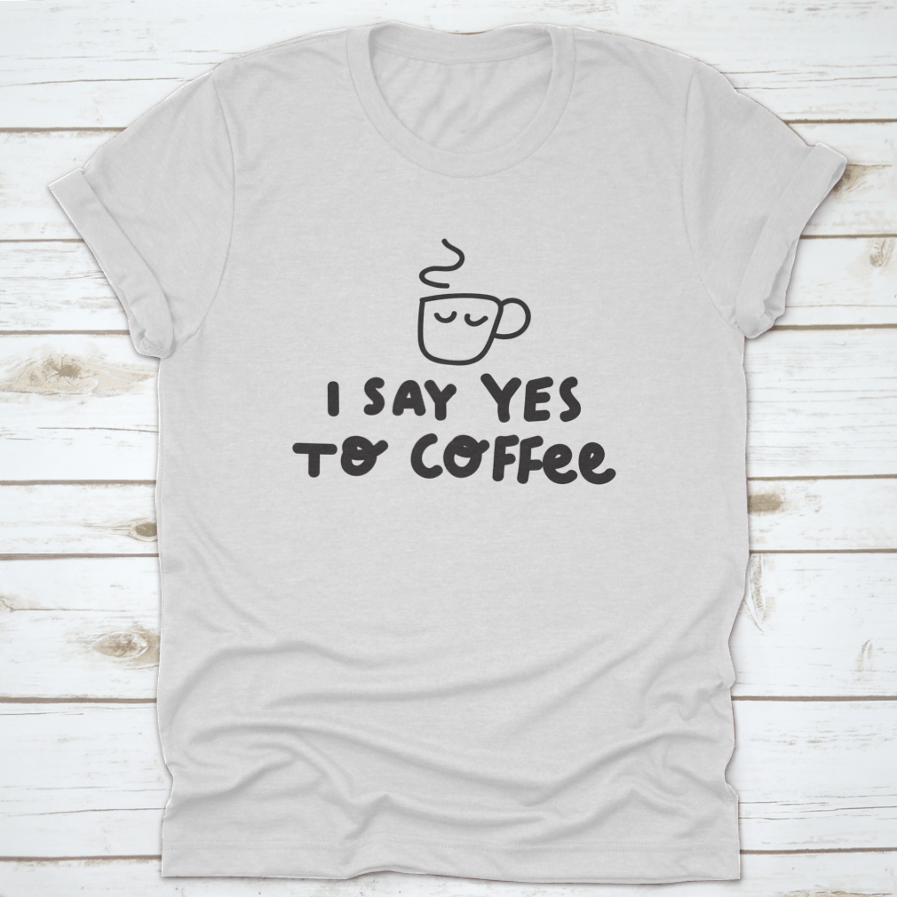 A humorous t-shirt featuring the phrase 'I Say Yes To Coffee' with a vector illustration, made from soft cotton fabric.