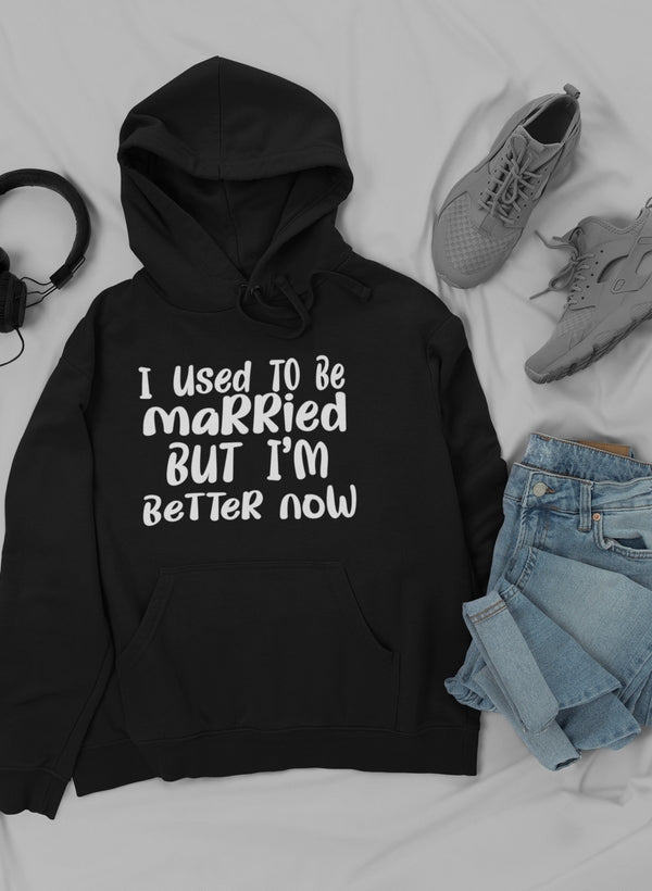 A stylish hoodie featuring the phrase 'I Used To Be Married But I'm' designed by top artists, showcasing a cozy cotton/poly fleece blend.