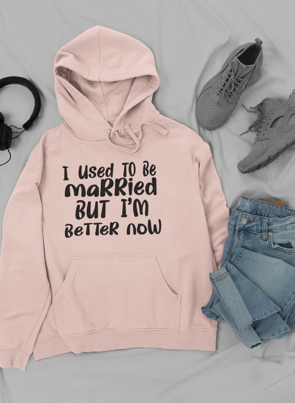 A stylish hoodie featuring the phrase 'I Used To Be Married But I'm' designed by top artists, showcasing a cozy cotton/poly fleece blend.