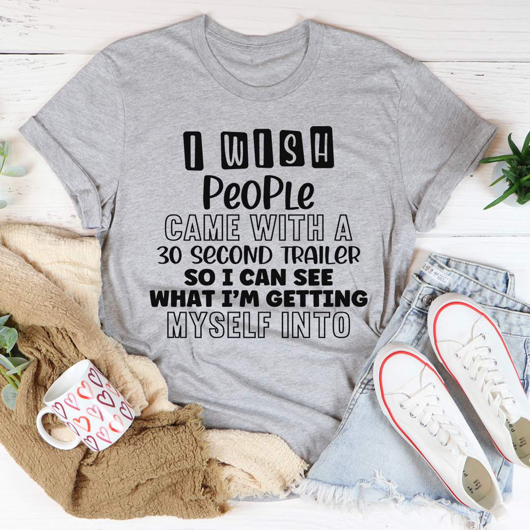 I Wish People Came With A 30 Second Trailer T-Shirt displayed on a mannequin, showcasing its soft cotton fabric and humorous design.