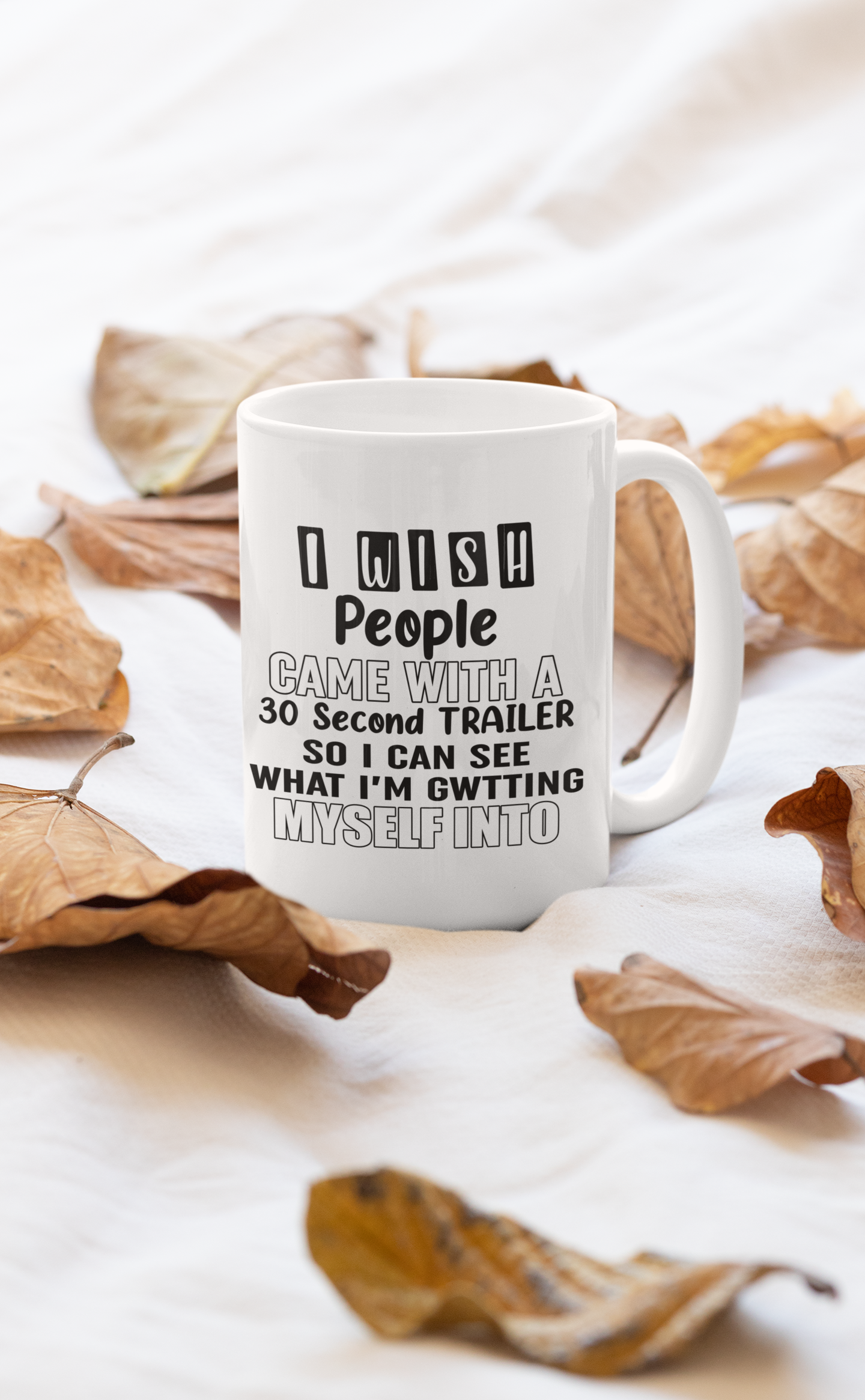 A glossy 11oz ceramic mug with the phrase 'I Wish People Came With A Mug' printed on it, featuring a sturdy handle.