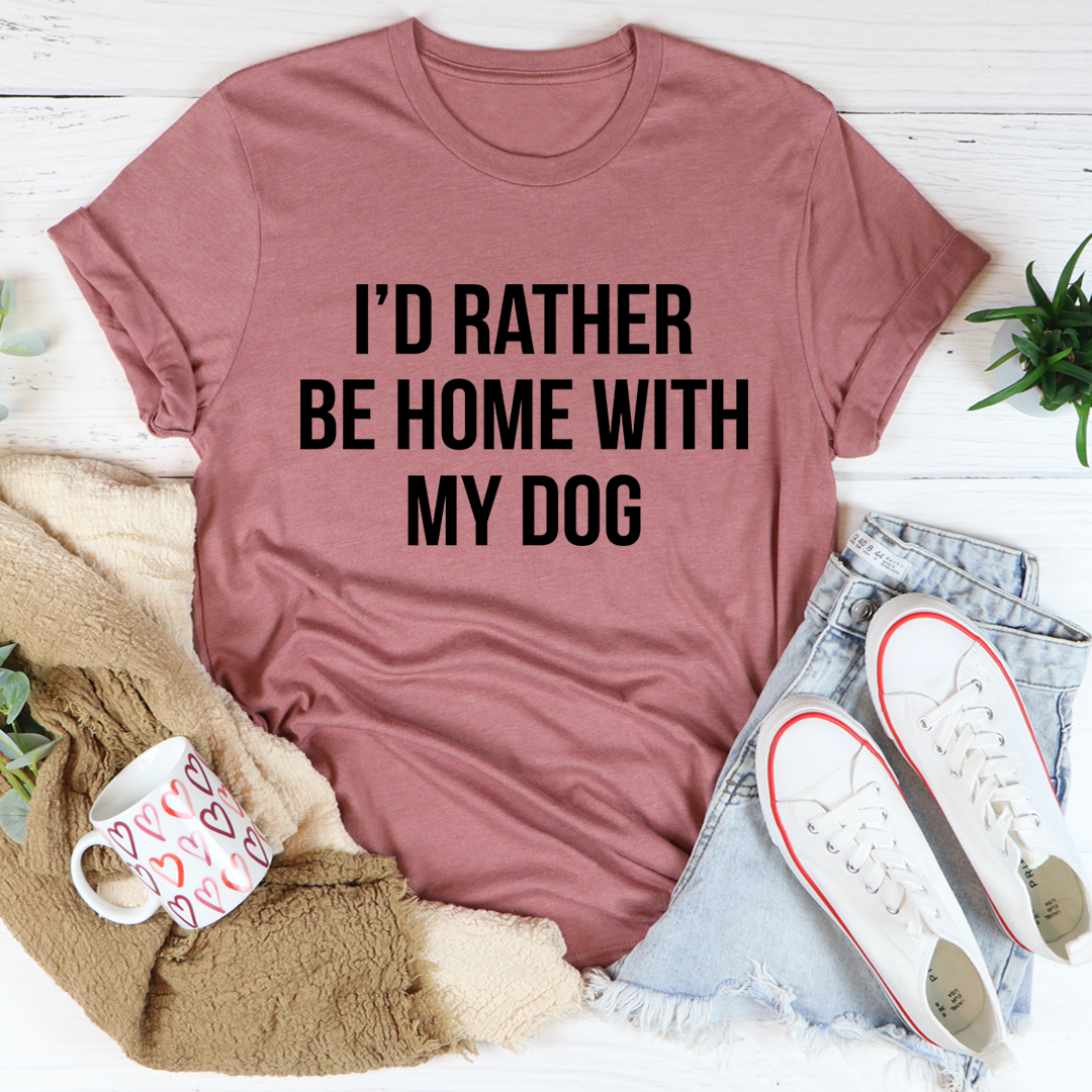 A comfortable and stylish t-shirt featuring the phrase 'I'd Rather Be Home With My Dog', made from soft ring-spun cotton.