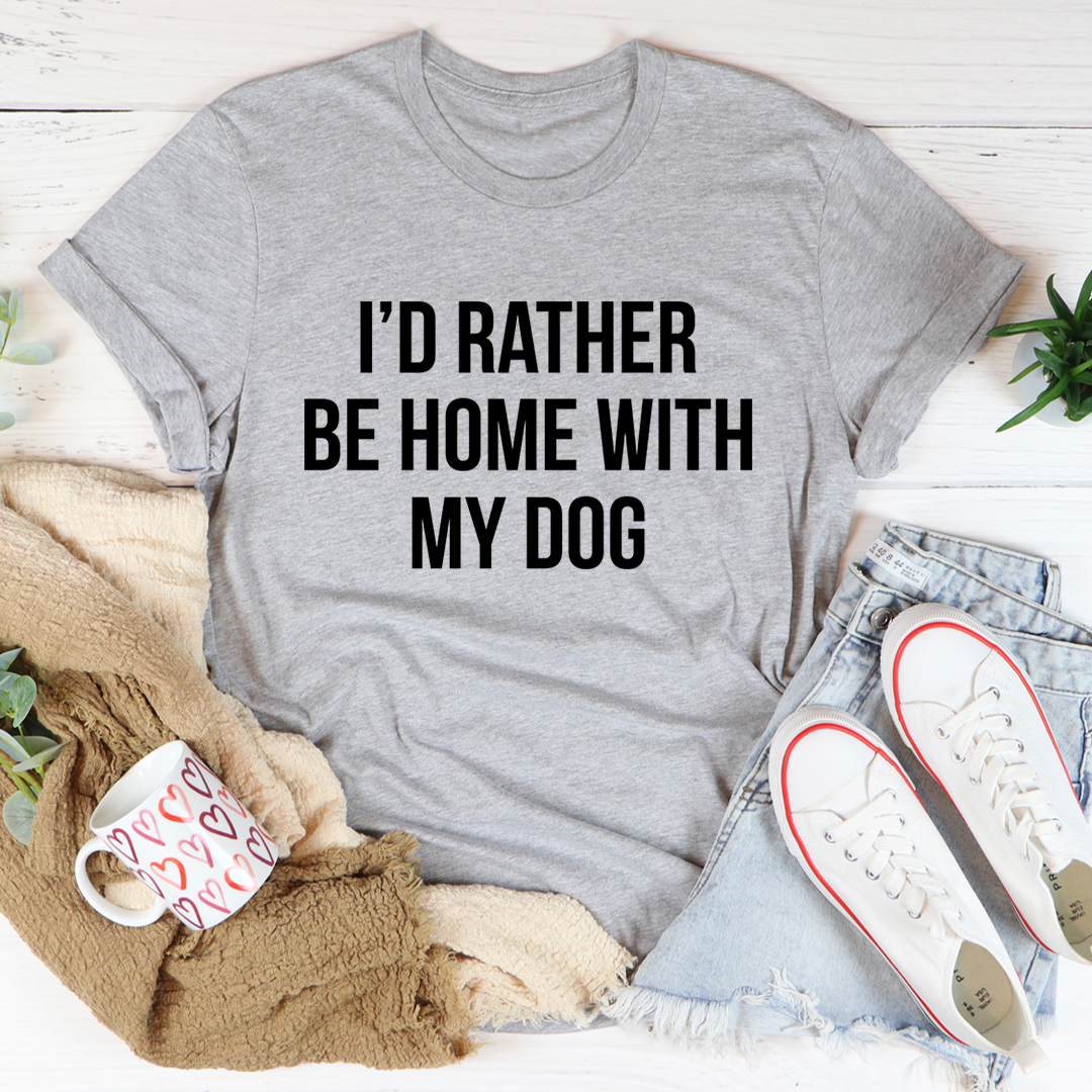 A comfortable and stylish t-shirt featuring the phrase 'I'd Rather Be Home With My Dog', made from soft ring-spun cotton.