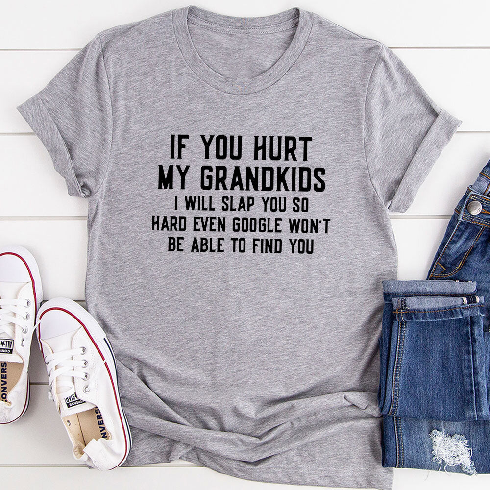 A comfortable t-shirt with the phrase 'If You Hurt My Grandkids' printed on it, showcasing a fun and loving design.