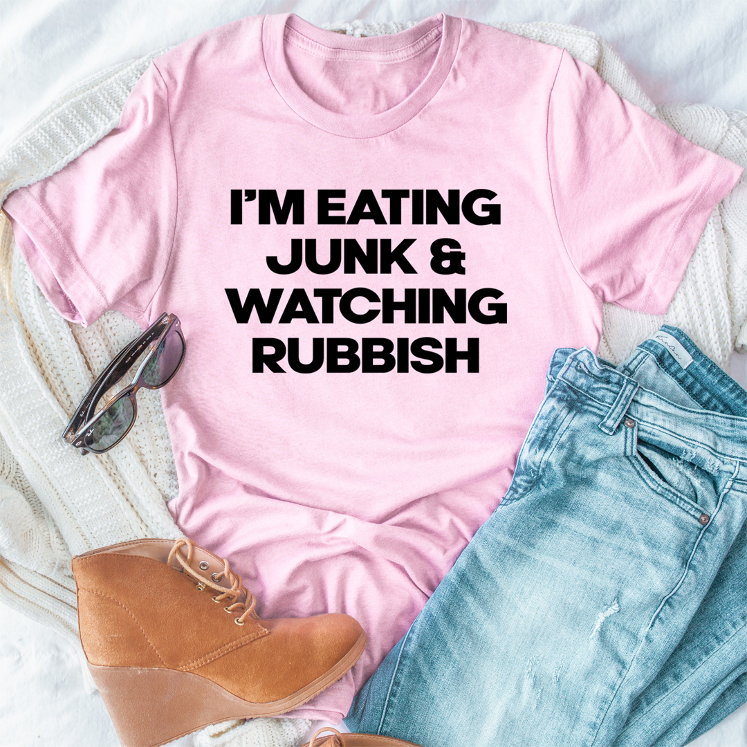 I'm Eating Junk & Watching Rubbish T-Shirt displayed on a mannequin, showcasing its soft cotton fabric and double-stitched neckline.