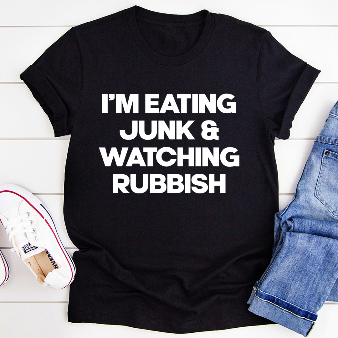 I'm Eating Junk & Watching Rubbish T-Shirt displayed on a mannequin, showcasing its soft cotton fabric and double-stitched neckline.