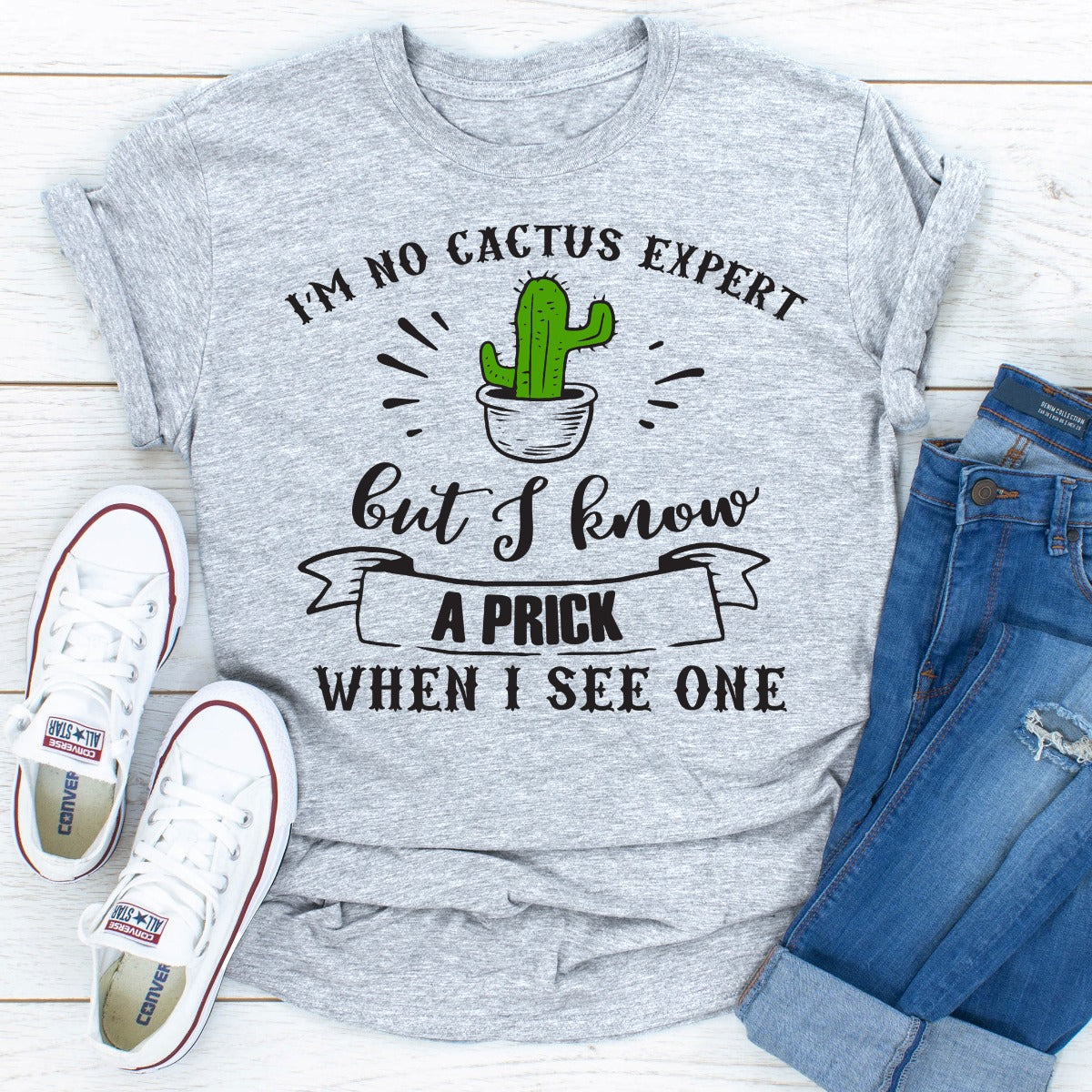 I'm No Cactus Expert T-Shirt displayed on a mannequin, showcasing its soft fabric and playful cactus design.