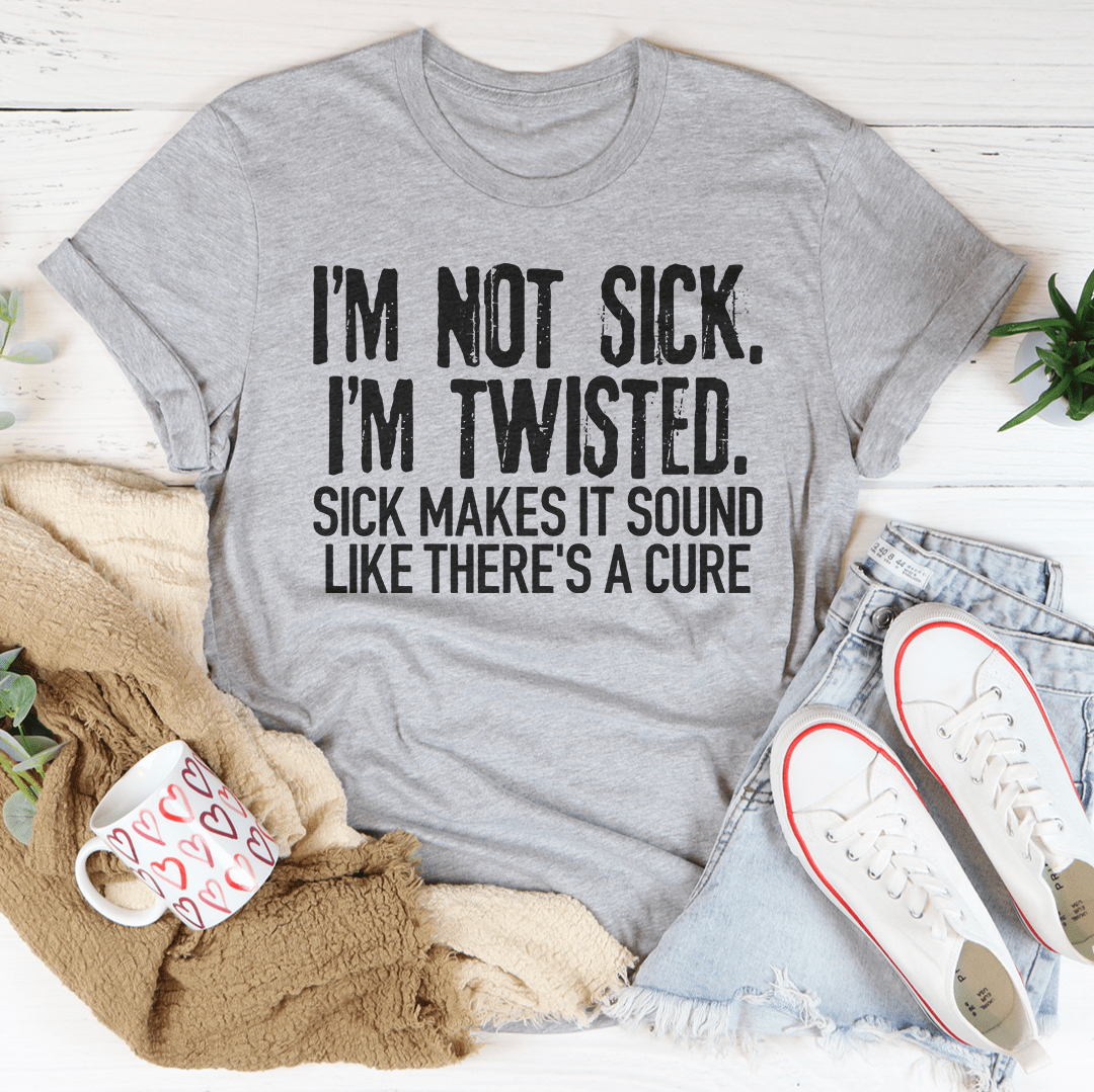 A stylish black t-shirt featuring the phrase 'I'm Not Sick I'm Twisted' in bold white letters, showcasing its soft fabric and durable stitching.