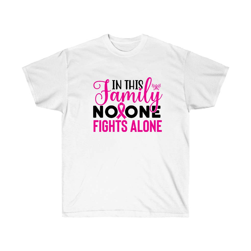 A pink t-shirt with the phrase 'In this Family No One Fights Alone' printed on it, symbolizing support for breast cancer awareness.