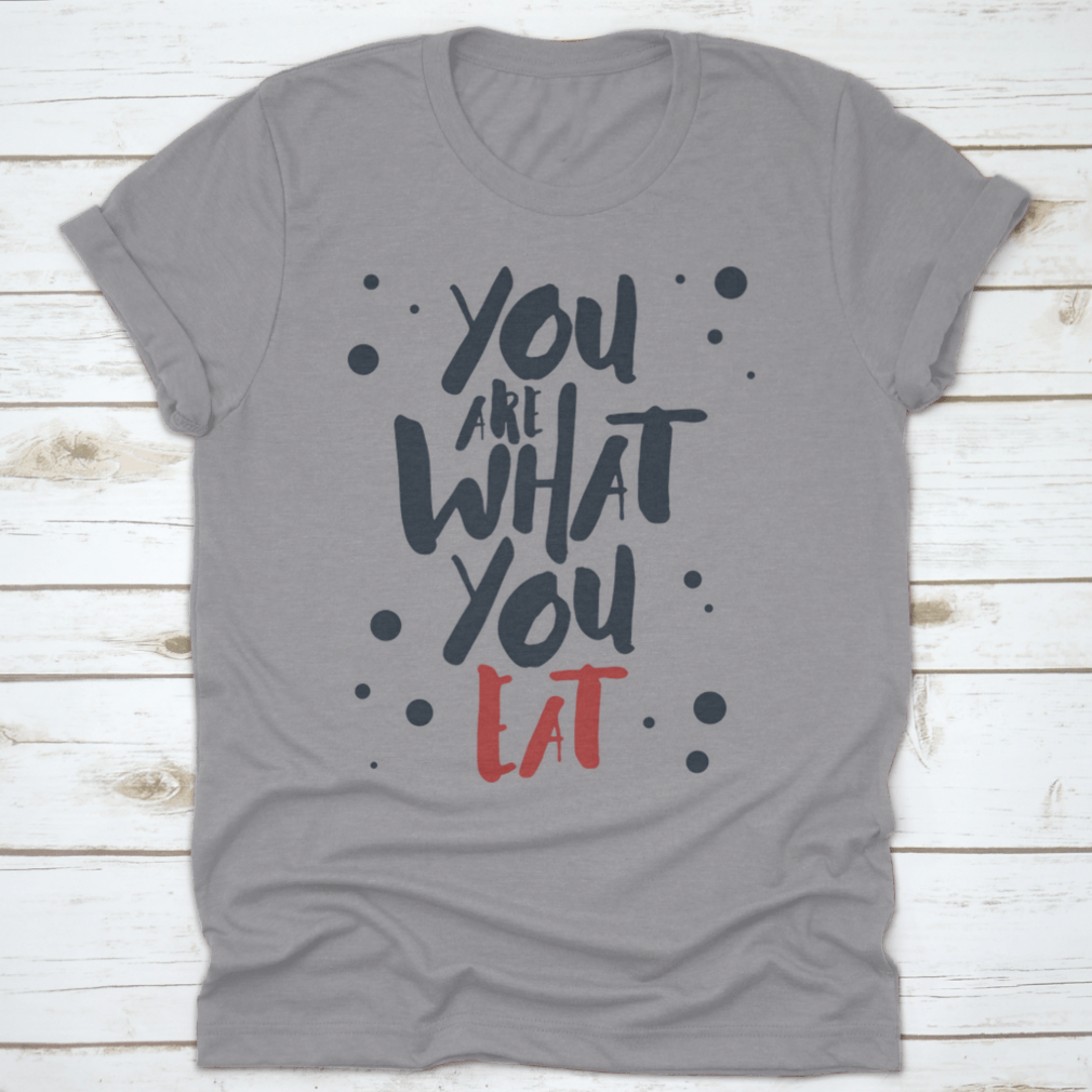 Inspirational T-shirt featuring red and black vector lettering on a white background, made from 100% cotton.