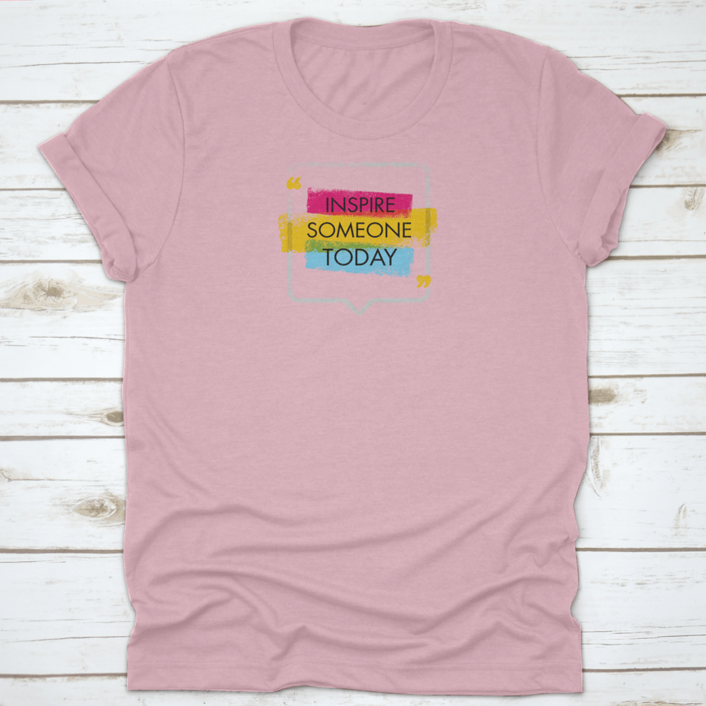 A motivational quote t-shirt featuring the phrase 'Inspire Someone Today', made from 100% cotton with a classic fit.