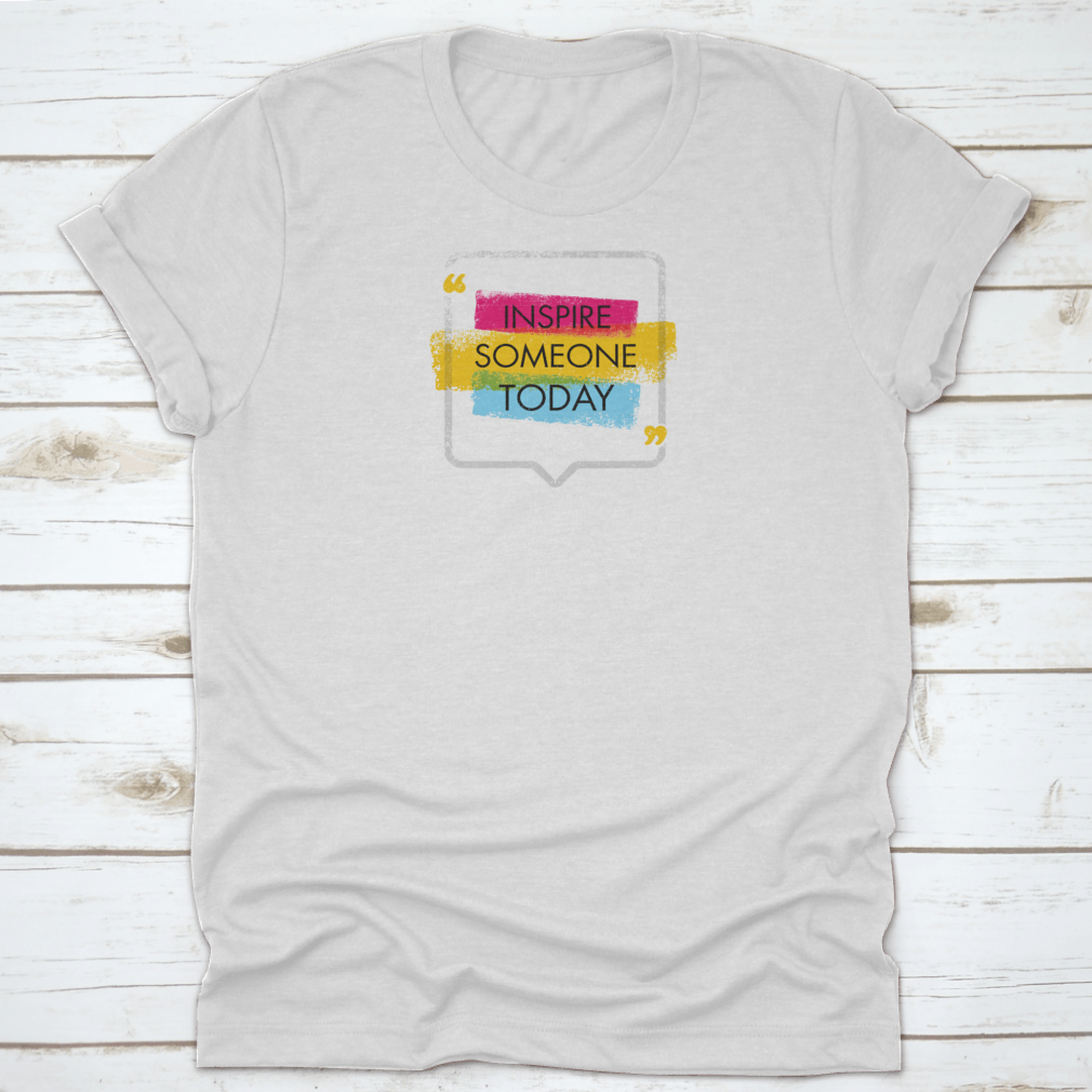 A motivational quote t-shirt featuring the phrase 'Inspire Someone Today', made from 100% cotton with a classic fit.