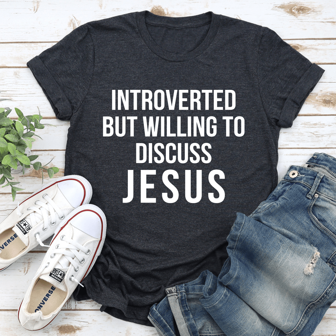 A comfortable and stylish t-shirt featuring the phrase 'Introverted But Willing To Discuss Jesus', made from soft ring-spun cotton.