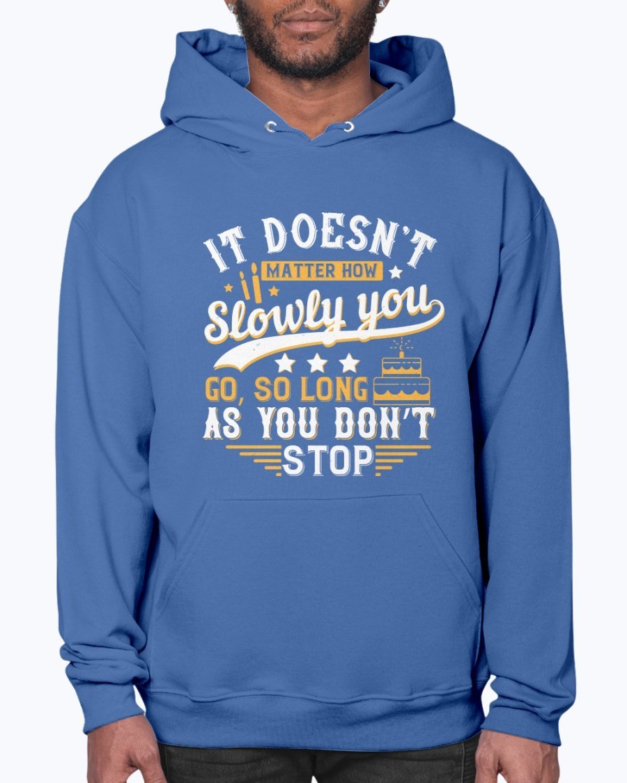 A cozy unisex hoodie featuring the motivational quote 'It doesn’t matter how slowly you go, so long as you don’t stop' in stylish font.