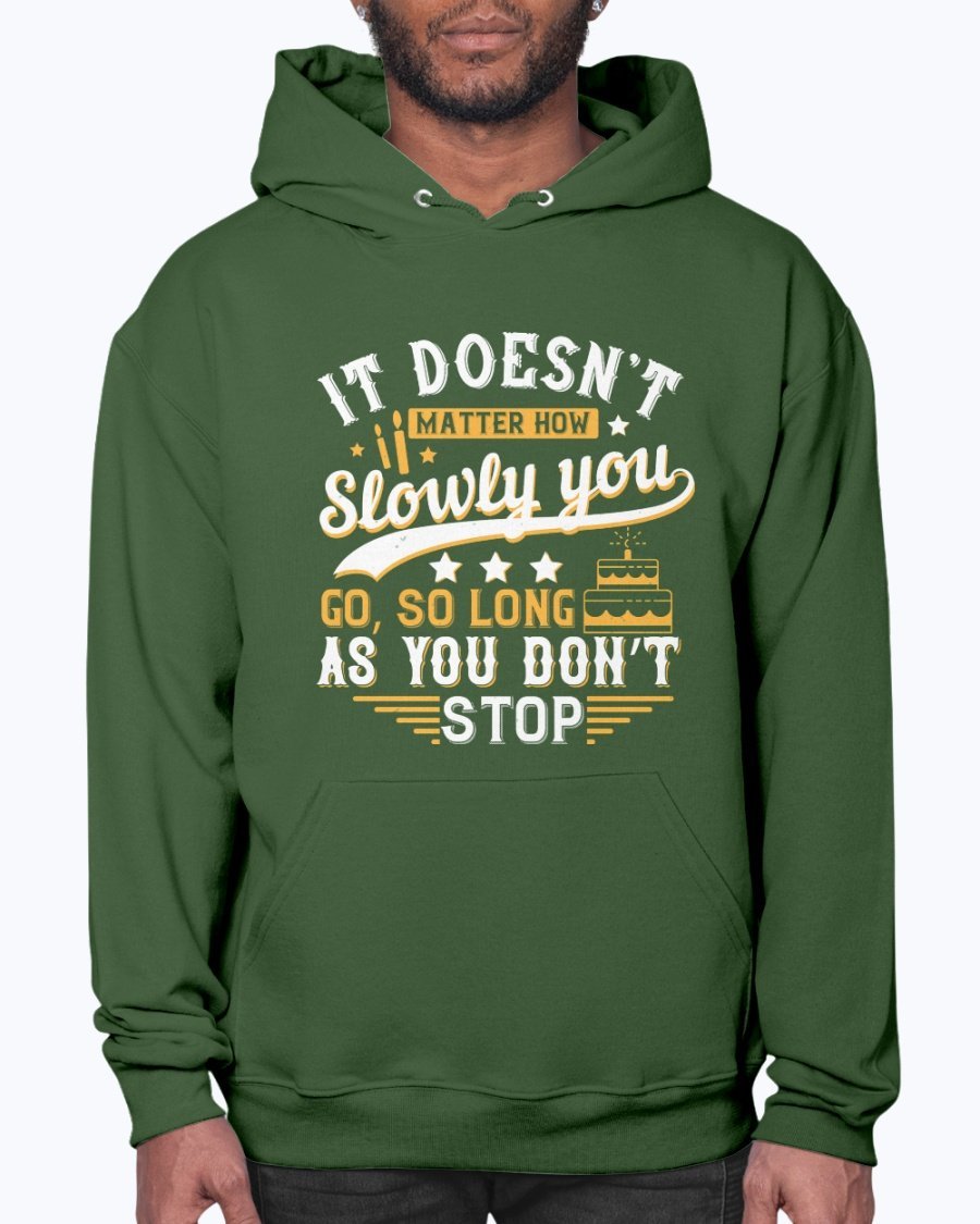 A cozy unisex hoodie featuring the motivational quote 'It doesn’t matter how slowly you go, so long as you don’t stop' in stylish font.