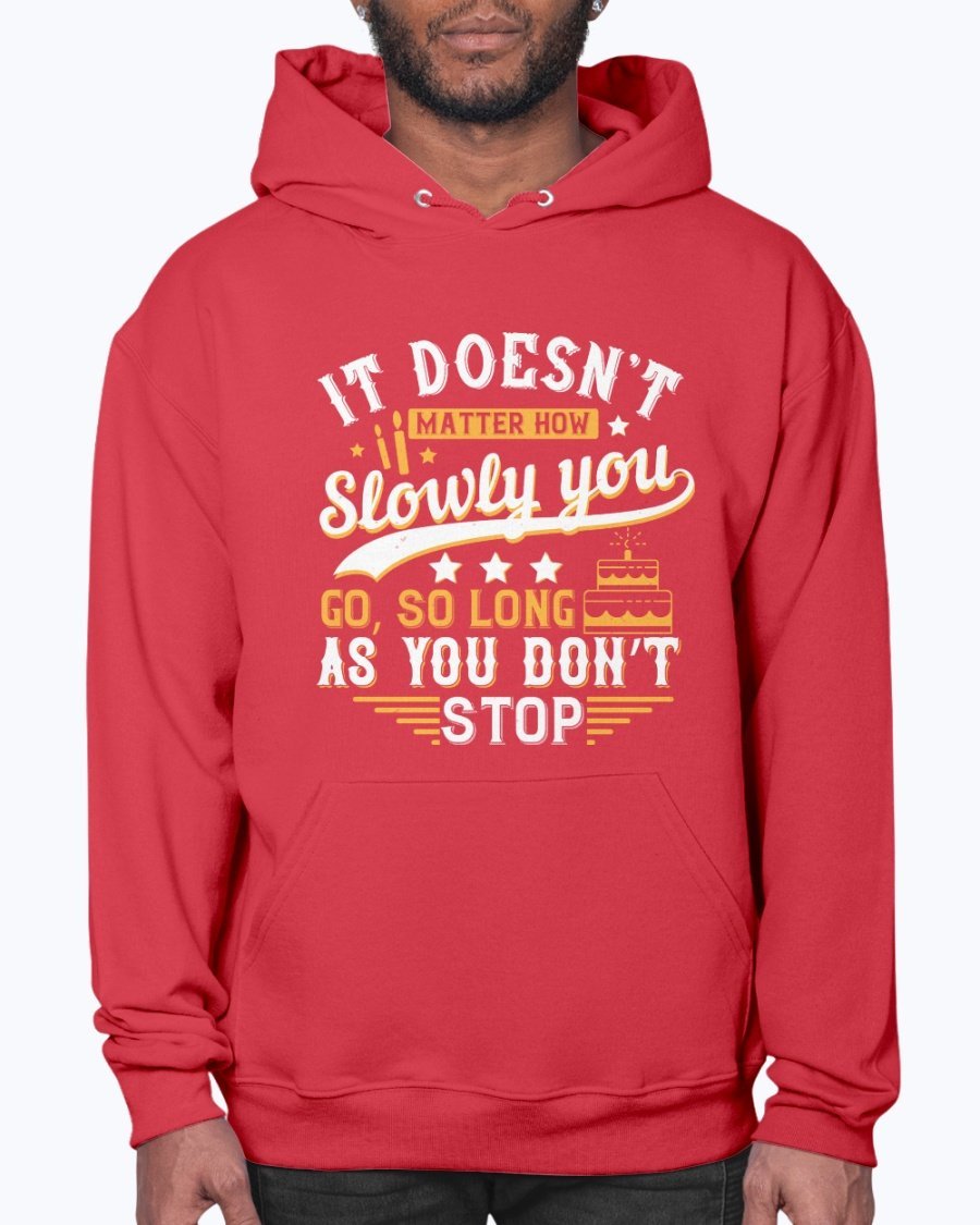 A cozy unisex hoodie featuring the motivational quote 'It doesn’t matter how slowly you go, so long as you don’t stop' in stylish font.