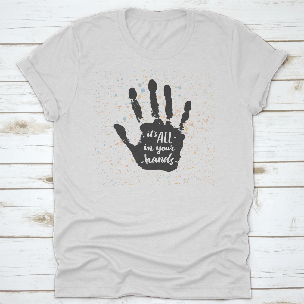 A stylish calligraphic quote shirt featuring the phrase 'It's All In Your Hands', made from soft cotton fabric.