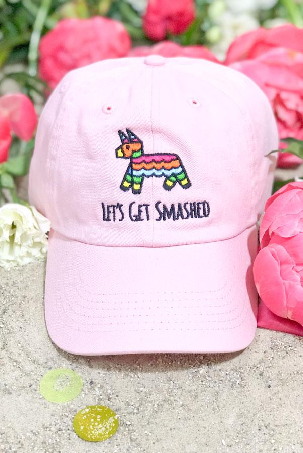 Embroidered bachelorette hats in white and soft pink with fun phrases for a fiesta theme.