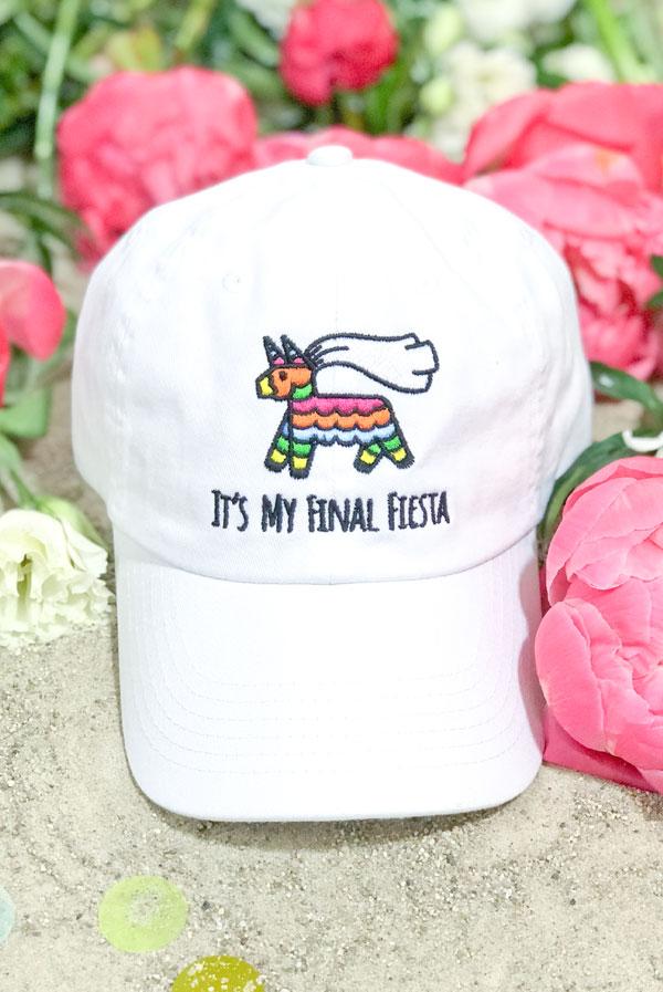 Embroidered bachelorette hats in white and soft pink with fun phrases for a fiesta theme.