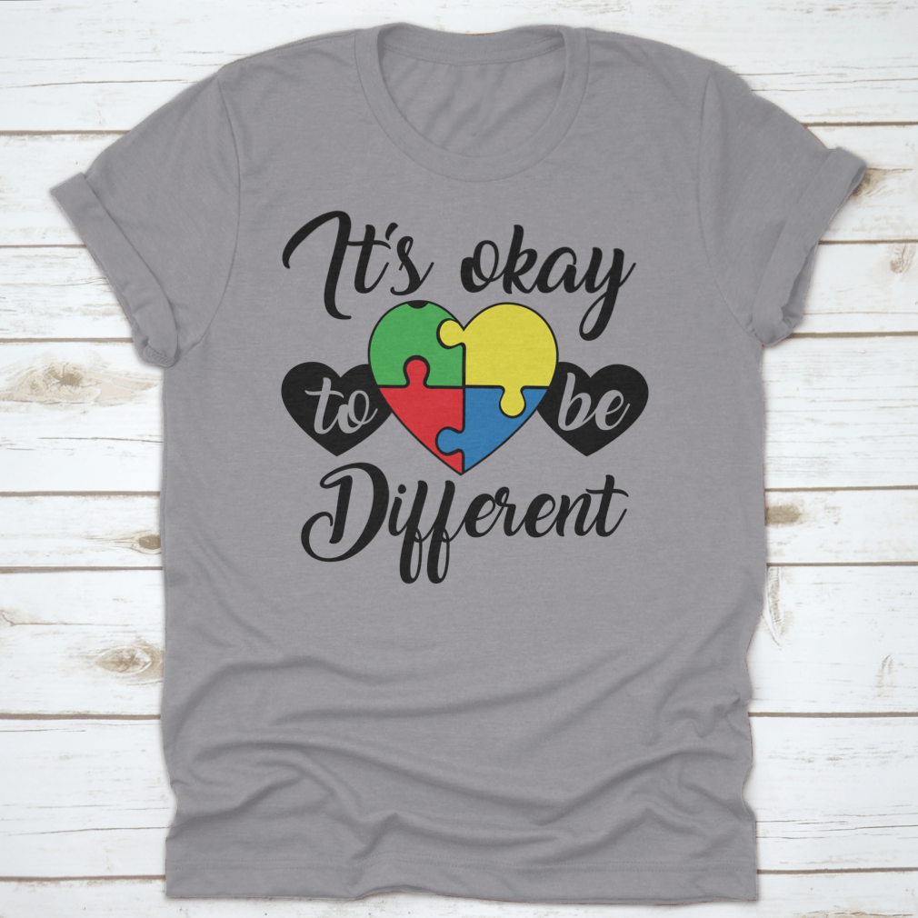 A soft, comfortable T-shirt featuring the phrase 'It's Okay To Be Different' in a stylish design, perfect for casual wear.